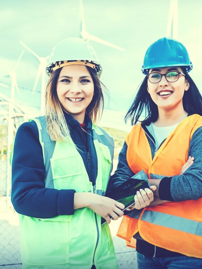 Image of two female interns working on job site